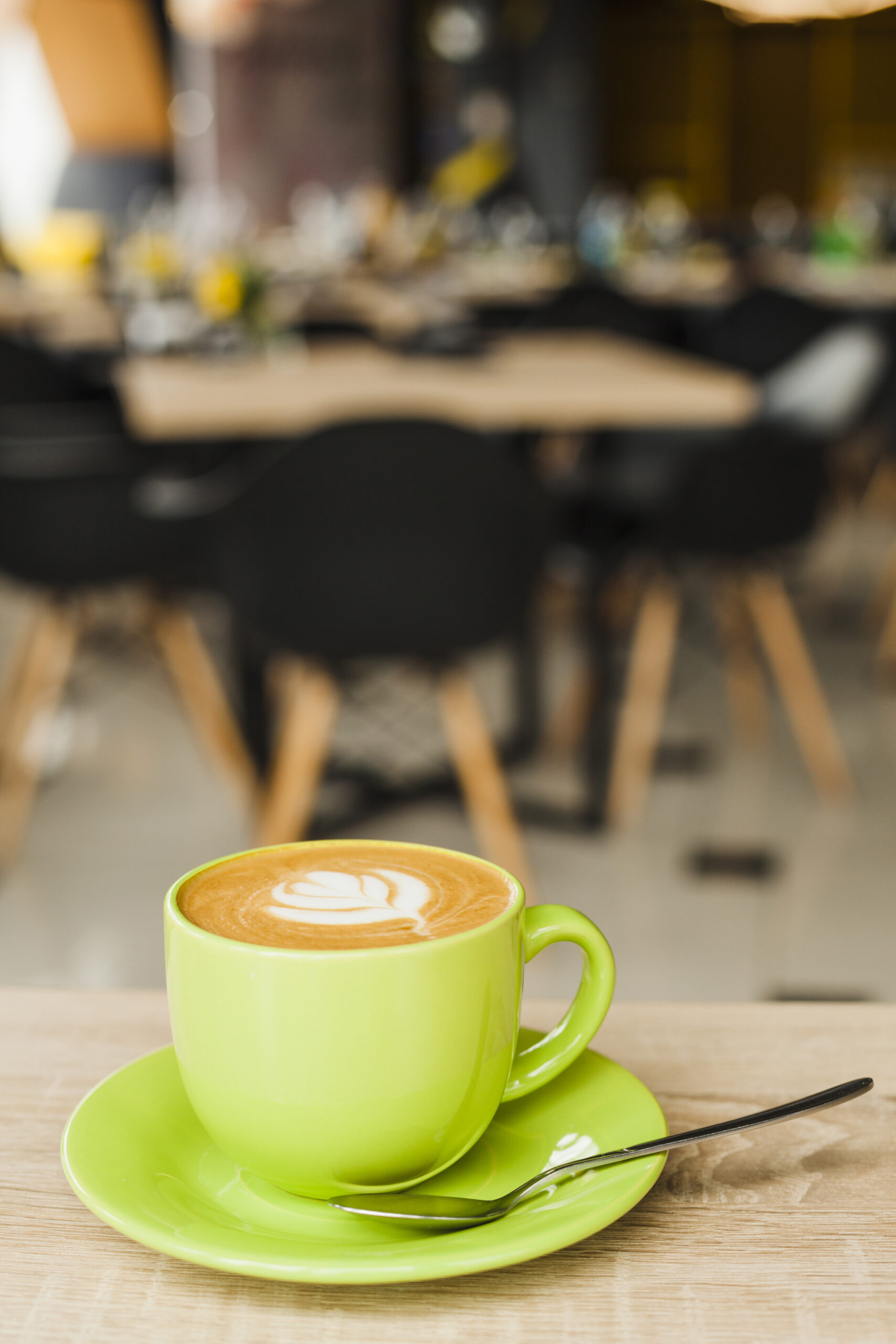 cup coffee with creative latte art wooden table cafeteria scaled